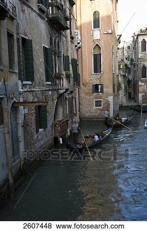 Tourists on gondolas in canal, Grand Canal, Veneto, Venice, Italy View Large Photo Image Stock Photo - Tourists on gondolas in canal, Grand Canal, Veneto, Venice, Italy . Fotosearch