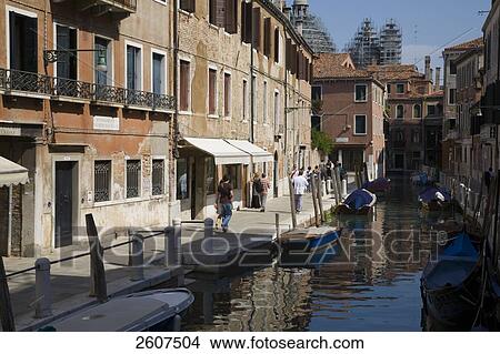Tourists walking along canal, Veneto, Venice, Italy View Large Photo Image Picture - Tourists walking along canal, Veneto, Venice, Italy . Fotosearch
