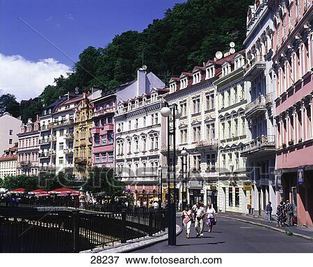 Tourists walking along houses in town, Carlsbad, Karlovy Vary, Czech Republic View Large Photo Image Stock Photo - Tourists walking along houses in town, Carlsbad, Karlovy Vary, Czech Republic . Fotosearch