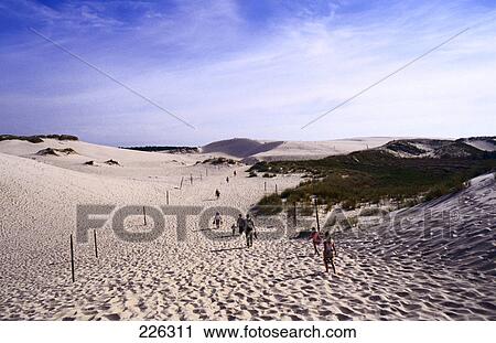 Tourists walking in desert, Poland View Large Photo Image Stock Image - Tourists walking in desert, Poland . Fotosearch
