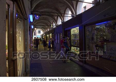 Stock Photo - Tourists walking in street market, Veneto, Venice, Italy . Fotosearch