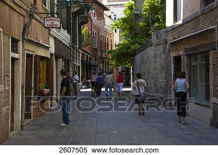 Stock Photography - Tourists walking in street, Veneto, Venice, Italy . Fotosearch