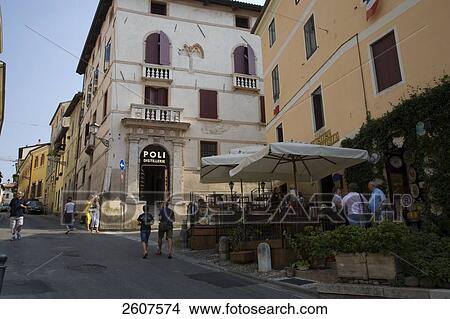 Picture - Tourists walking on road, Bassano Di Grappa, Piazza Liberta, Veneto, Italy . Fotosearch