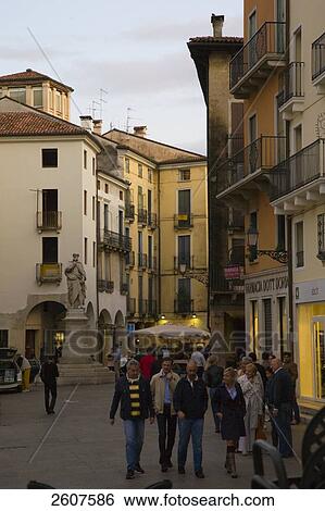 Stock Photograph - Tourists walking on road, Vicenza, Veneto, Italy . Fotosearch