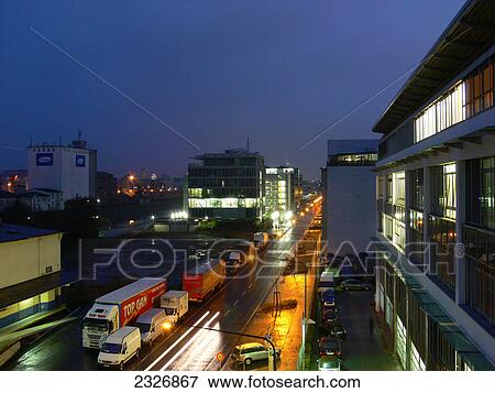 Stock Photo - Traffic on city road lit up at dusk, Frankfurt, Germany . Fotosearch