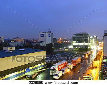 Stock Photo - Traffic on city road lit up at dusk, Frankfurt, Germany . Fotosearch