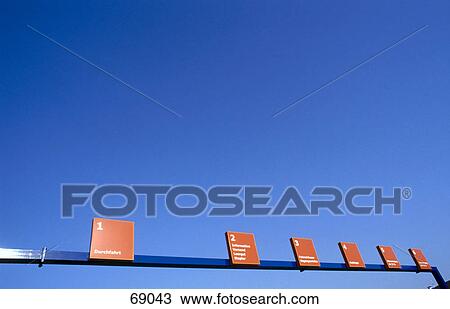 Traffic organizing signs against blue sky View Large Photo Image Stock Image - Traffic organizing signs against blue sky . Fotosearch