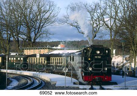 Stock Image - Train at railway station, Ruegen, Mecklenburg-Western Pomerania, Germany . Fotosearch