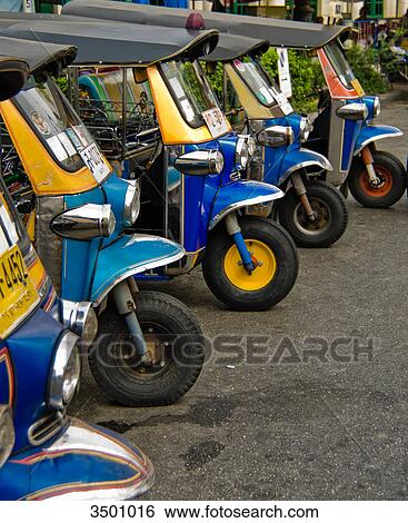 Stock Photograph - Tuk-Tuks at the roadside, Bangkok, Thailand . Fotosearch