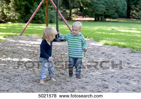 Two girls at playground View Large Photo Image Stock Photo - Two girls at playground . Fotosearch