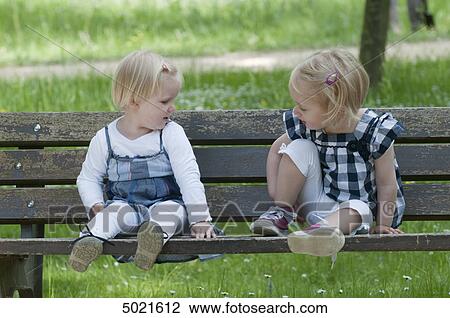 Two girls in park View Large Photo Image Stock Image - Two girls in park . Fotosearch