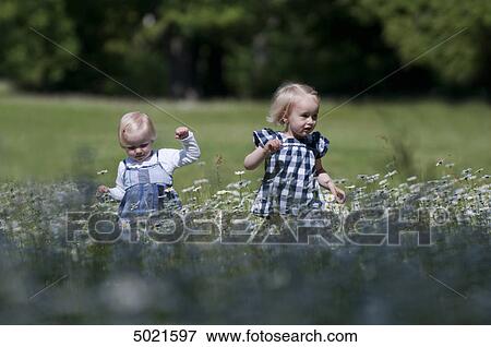 Two girls in park View Large Photo Image Stock Photo - Two girls in park . Fotosearch