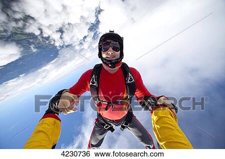 Stock Photograph - Two male parachute jumpers, Saanen, Canton Bern, Switzerland . Fotosearch