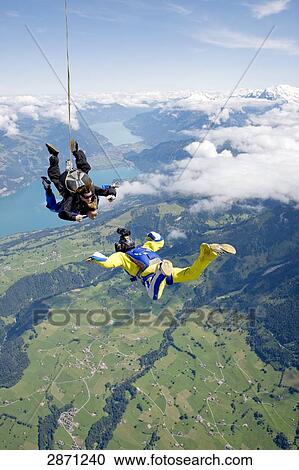 two parachute jumpers, full shot  View Large Photo Image Stock Image - two parachute jumpers, full shot . Fotosearch