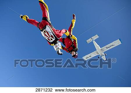 Two Parachutists doing free fall, Switzerland View Large Photo Image Stock Image - Two Parachutists doing free fall, Switzerland . Fotosearch