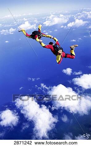 two people doing parachute jumping, full shot View Large Photo Image Stock Image - two people doing parachute jumping, full shot . Fotosearch