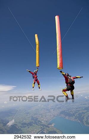 two people doing parachute jumping, full shot View Large Photo Image Stock Image - two people doing parachute jumping, full shot . Fotosearch