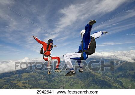 two people doing parachute jumping, full shot View Large Photo Image Stock Image - two people doing parachute jumping, full shot . Fotosearch