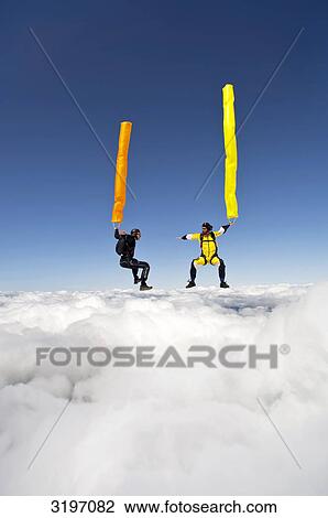 Stock Image - Two skydiver with tube, Reichenbach, Bern, Switzerland . Fotosearch