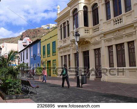 Two women walking in street, Calle Real, La Gomera, Canary Islands, Spain View Large Photo Image Stock Photography - Two women walking in street, Calle Real, La Gomera, Canary Islands, Spain . Fotosearch