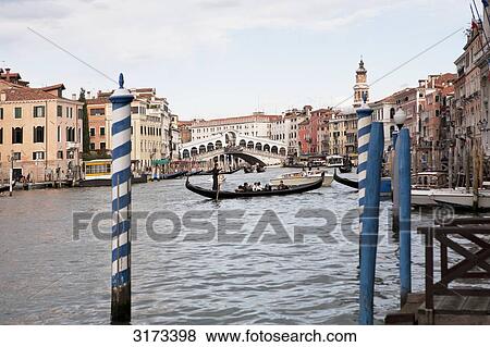 Stock Photo - View from jetty to canal with gondolas, Venice, Italy . Fotosearch