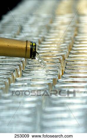 White wine being poured into glass View Large Photo Image Stock Photo - White wine being poured into glass . Fotosearch