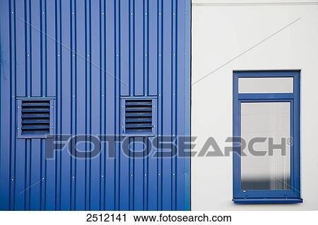 Stock Image - Windows on wall of storehouse . Fotosearch