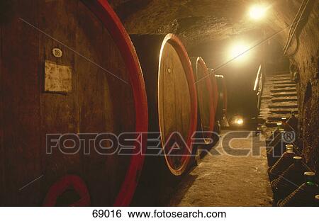 Stock Photograph - Wine barrels in cellar . Fotosearch