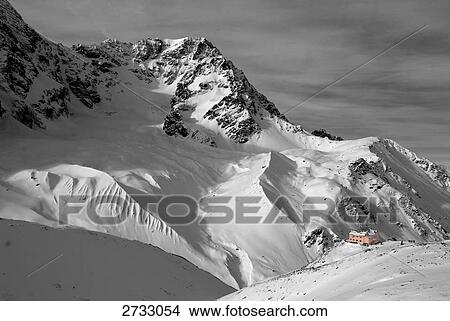 Picture - Aerial view of building on snow covered mountain, Trentino-Alto Adige, Italy . Fotosearch
