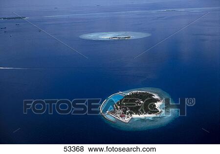 Stock Photo - Aerial view of island in ocean, Maldives . Fotosearch