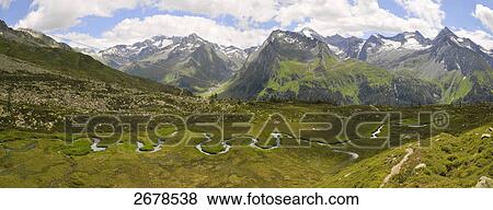 Stock Photo - Aerial view of river flowing through landscape, Trentino-Alto Adige, Italy . Fotosearch