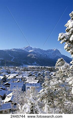 Aerial view of town covered in snow, Garmisch Partenkirchen, Bavaria, Germany View Large Photo Image Picture - Aerial view of town covered in snow, Garmisch Partenkirchen, Bavaria, Germany . Fotosearch