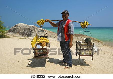 Stock Image - Beach vendor, Chaweng Beach, Ko Samui, Thailand . Fotosearch