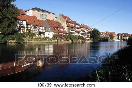 Stock Photo - Boat in river, River Regnitz, Bamberg, Bavaria, Germany . Fotosearch