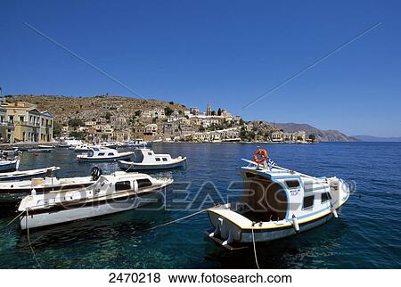 Stock Photo - Boats at harbor, Symi, Dodecanese Islands, Southern Aegean, Greece . Fotosearch