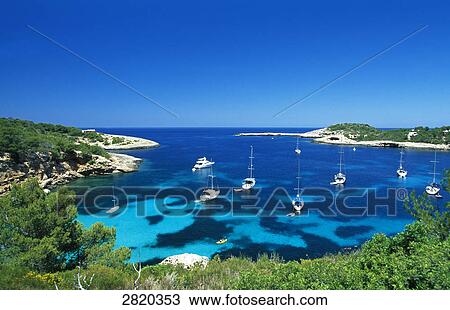Stock Image - Boats in sea, Portinatx, Ibiza, Balearic Islands, Spain . Fotosearch