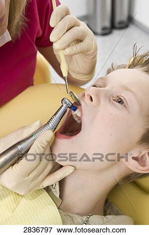Boy at dentist View Large Photo Image Stock Photo - Boy at dentist . Fotosearch