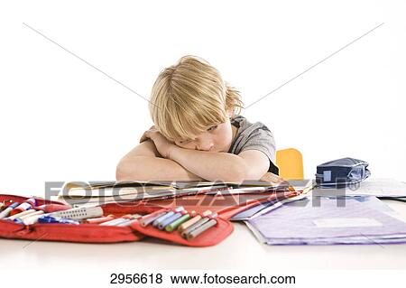 Stock Photo - boy is frustrated of his school homework . Fotosearch
