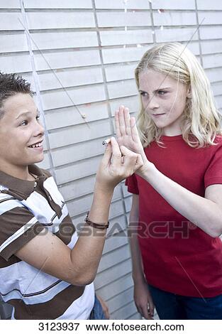 Stock Photo - Boy offering girl a cigarette . Fotosearch