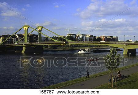 Bridge over river, Main River, Floesserbruecke Bridge, Frankfurt, Hesse, Germany View Large Photo Image Stock Photo - Bridge over river, Main River, Floesserbruecke Bridge, Frankfurt, Hesse, Germany . Fotosearch