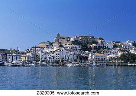 Stock Photography - Buildings at waterfront, Ibiza, Balearic Islands, Spain . Fotosearch