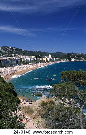 Stock Photograph - Buildings at waterfront, Lloret de Mar, Girona Province, Catalonia, Spain . Fotosearch
