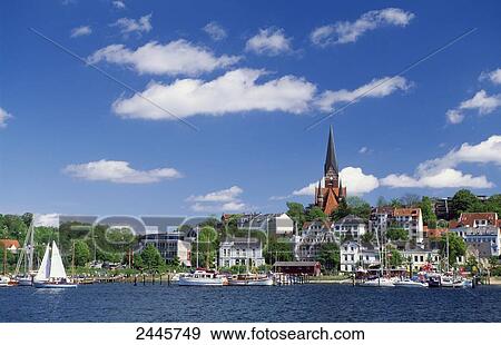 Buildings at waterfront, St. Juergen Church, Flensburg, Schleswig-Holstein, Germany View Large Photo Image Stock Photo - Buildings at waterfront, St. Juergen Church, Flensburg, Schleswig-Holstein, Germany . Fotosearch