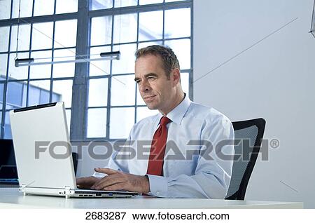 businessman and his notebook, portrait View Large Photo Image Stock Photo - businessman and his notebook, portrait . Fotosearch
