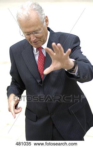 Businessman holding out hand in stop gesture View Large Photo Image Stock Photography - Businessman holding out hand in stop gesture . Fotosearch