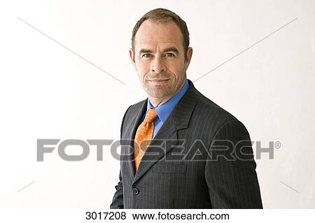 Businessman looking into the camera View Large Photo Image Stock Photo - Businessman looking into the camera . Fotosearch