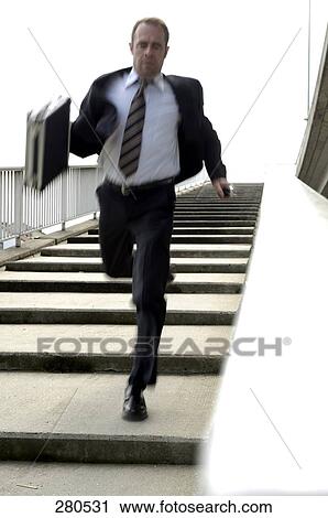 Businessman running downstairs View Large Photo Image Stock Image - Businessman running downstairs . Fotosearch