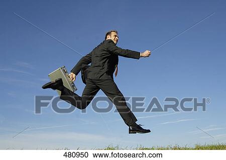 Businessman running in midair View Large Photo Image Stock Image - Businessman running in midair . Fotosearch
