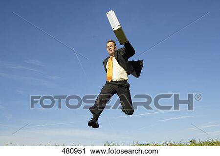 Businessman running in midair View Large Photo Image Stock Image - Businessman running in midair . Fotosearch