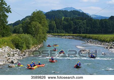Stock Photograph - Canoes on Iller, Allgaeu, Bavaria, Germany, Europe . Fotosearch